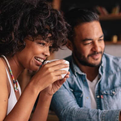 Happy Young Couple in Cafe