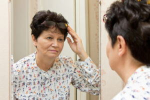 woman realizing she needs new prescription