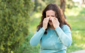 Woman rubbing her eyes