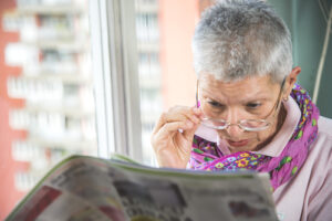 Woman looking over glasses